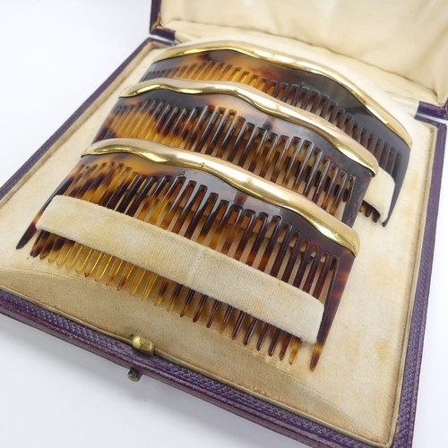 330 - Asprey; An early 20thC cased trio of graduated tortoiseshell Combs / Hair Ornaments, of domed form w... 