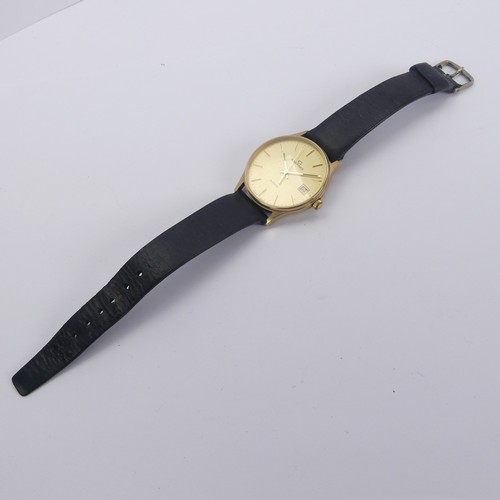 129 - A 9ct yellow gold Garrard quartz Wristwatch, the reverse with presentation inscription, 33mm diamete... 