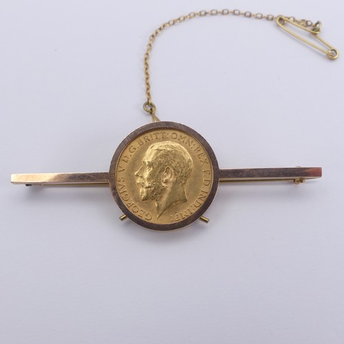 288 - A George V gold Half Sovereign, dated 1914, in 9ct gold brooch mount, total weight 7g.... 