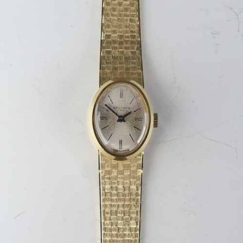 134 - An 18ct yellow gold lady's Wristwatch, the oval silvered dial signed Belcron, with Swiss 17-jewels m... 