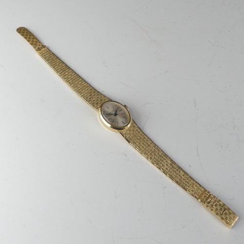 134 - An 18ct yellow gold lady's Wristwatch, the oval silvered dial signed Belcron, with Swiss 17-jewels m... 