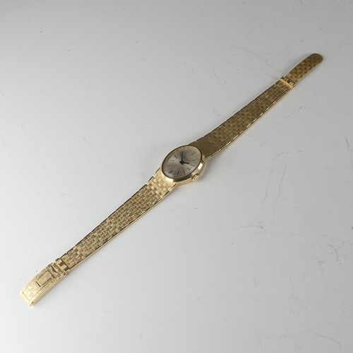 134 - An 18ct yellow gold lady's Wristwatch, the oval silvered dial signed Belcron, with Swiss 17-jewels m... 