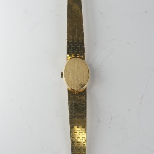 134 - An 18ct yellow gold lady's Wristwatch, the oval silvered dial signed Belcron, with Swiss 17-jewels m... 