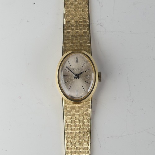 134 - An 18ct yellow gold lady's Wristwatch, the oval silvered dial signed Belcron, with Swiss 17-jewels m... 