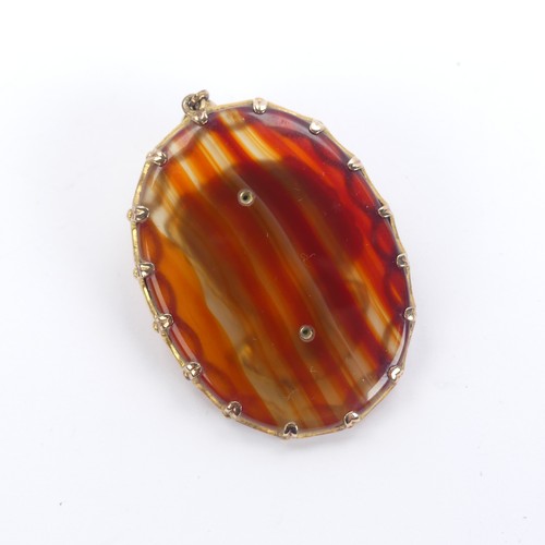 268 - A 9ct yellow gold mounted agate Pendant, in the antique French style, the centre with applied gold f... 