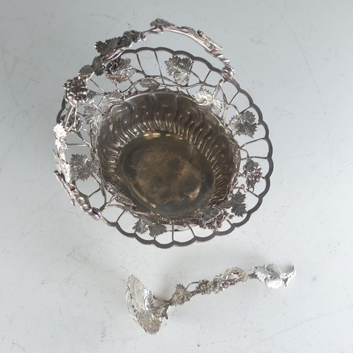 121 - A Continental silver swing handled Basket, of oval form, the rim pierced with fruit and vine decorat... 