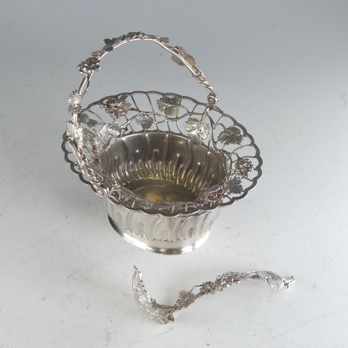 121 - A Continental silver swing handled Basket, of oval form, the rim pierced with fruit and vine decorat... 