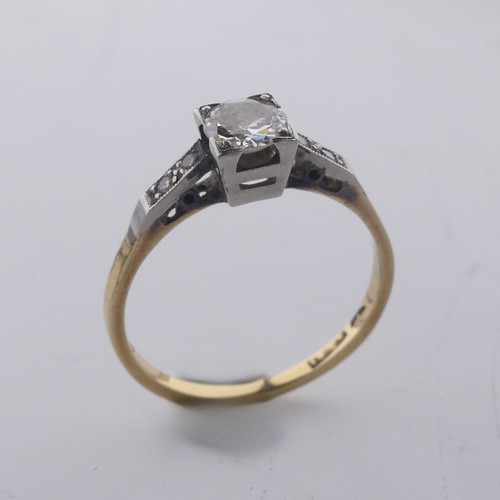 188 - A single stone diamond Ring, the circular stone approx. 0.4ct, in squared mount with two small diamo... 