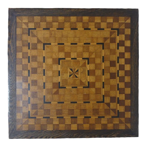 551 - An Arts and Crafts oak and inlaid Table, the square top with geometric inlay raised on central pilla... 