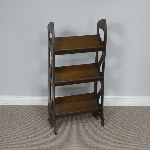 560 - A Glasgow school Arts and Crafts oak Bookshelf/Stand, the sides with stylised piercing, W 45,5 cm x ... 