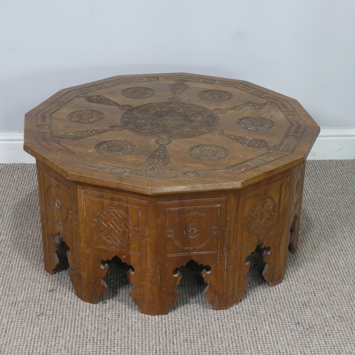 521 - An Arts and Crafts Anglo-Indian centre Table, the dodecagon top carved with stylised flowers and geo... 