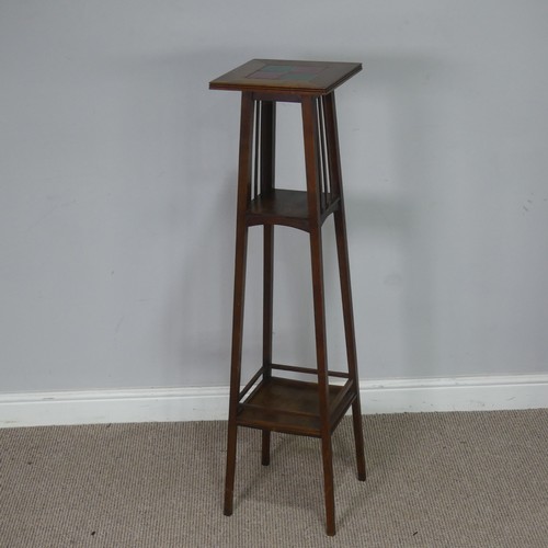 559 - An Arts & Crafts oak three tiered tiled top plant Stand, in the manner of Shapland and Petter of... 