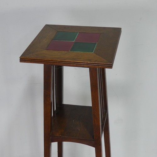 559 - An Arts & Crafts oak three tiered tiled top plant Stand, in the manner of Shapland and Petter of... 