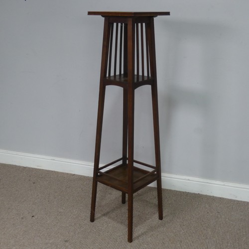 559 - An Arts & Crafts oak three tiered tiled top plant Stand, in the manner of Shapland and Petter of... 