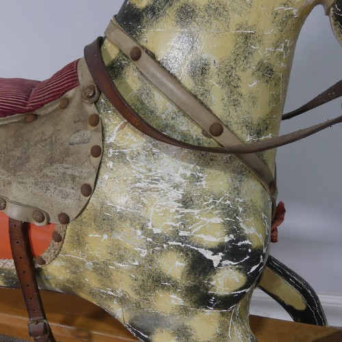 562 - An antique painted Rocking Horse, note, with wear and losses commensurate to daily use and age, see ... 