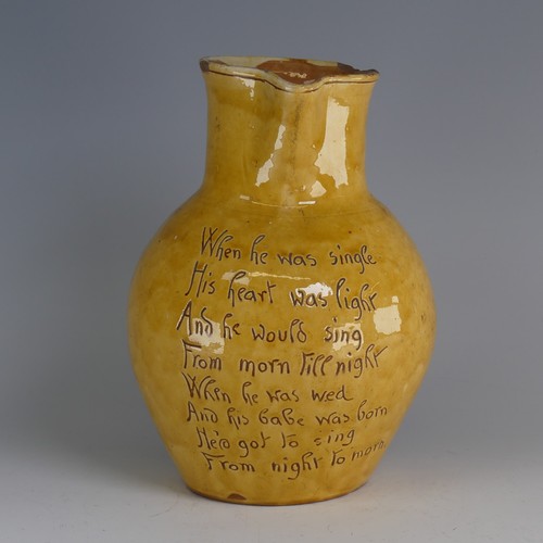 19 - Edwin Beer Fishley (1832-1912) a Fremington pottery mottoware Jug, in typical yellow glaze with inci... 