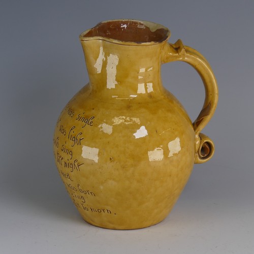 19 - Edwin Beer Fishley (1832-1912) a Fremington pottery mottoware Jug, in typical yellow glaze with inci... 