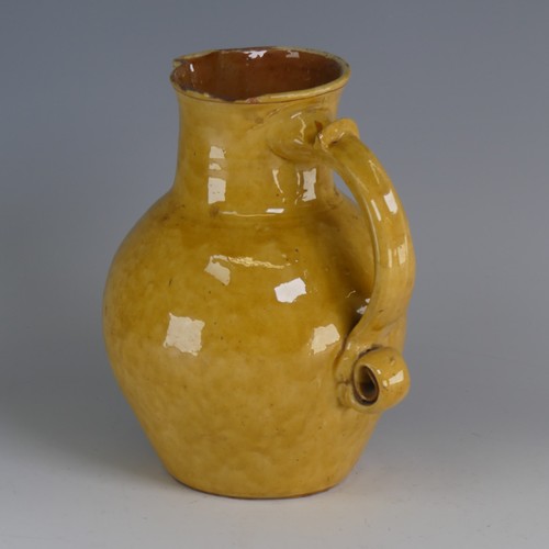 19 - Edwin Beer Fishley (1832-1912) a Fremington pottery mottoware Jug, in typical yellow glaze with inci... 