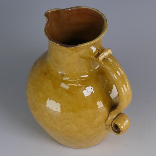 19 - Edwin Beer Fishley (1832-1912) a Fremington pottery mottoware Jug, in typical yellow glaze with inci... 