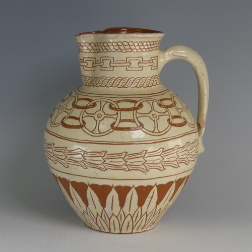 46 - William Fishley Holland (1888-1971) a Braunton pottery Harvest Jug, with white slip profusely decora... 