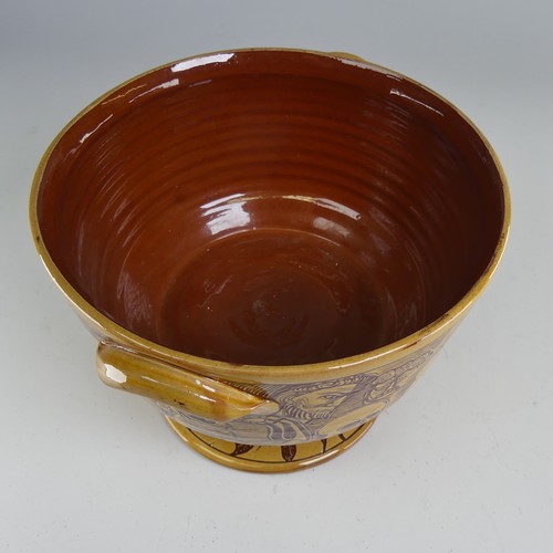 63 - Harry Juniper (b. 1947) a Bideford Pottery 'Devil's Bowl', in honey slip decorated profusely with sg... 