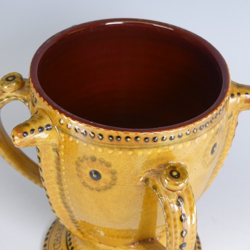 59 - Harry Juniper (b. 1947) a Bideford pottery Royal Possett Cup, decorated in honey slip with stud work... 