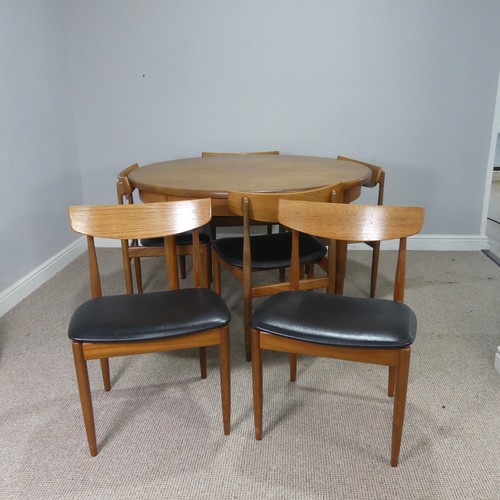 565 - A mid-20th century G-Plan teak dining Table and six Chairs, probably designed by E Gomme, the circul... 