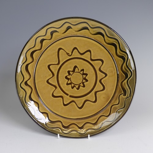 65 - Nick Juniper (20th century) a Bideford Pottery slipware Charger, typical combed decoration, incised ... 