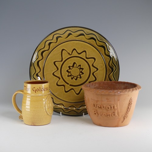 65 - Nick Juniper (20th century) a Bideford Pottery slipware Charger, typical combed decoration, incised ... 