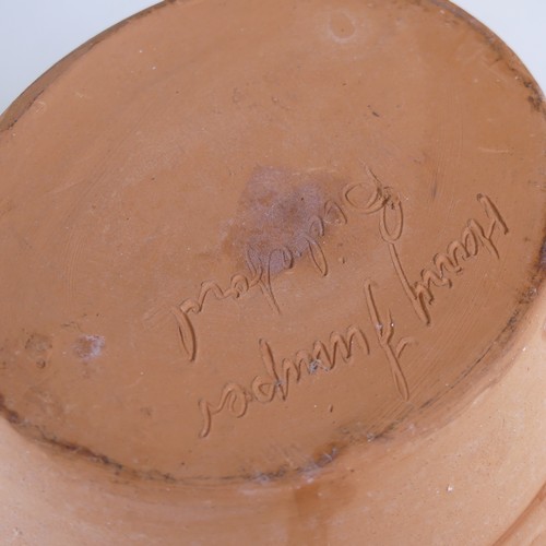 65 - Nick Juniper (20th century) a Bideford Pottery slipware Charger, typical combed decoration, incised ... 