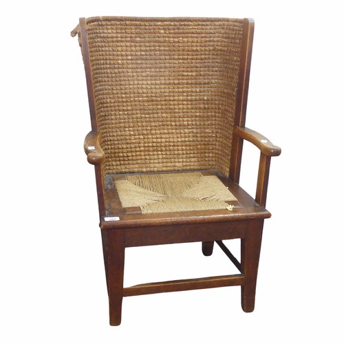 584 - An early 20th century oak framed Orkney child's Chair, in the manner of David Kirkness, the curved w... 