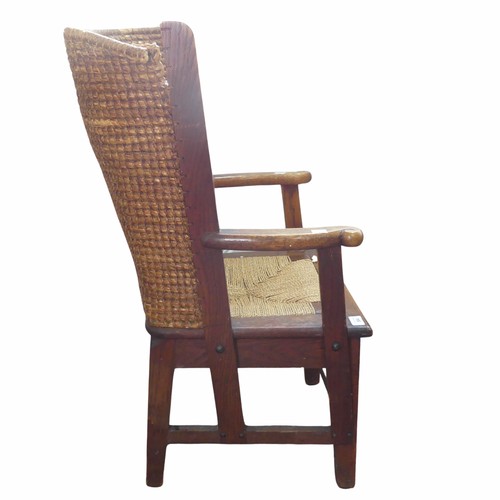 584 - An early 20th century oak framed Orkney child's Chair, in the manner of David Kirkness, the curved w... 