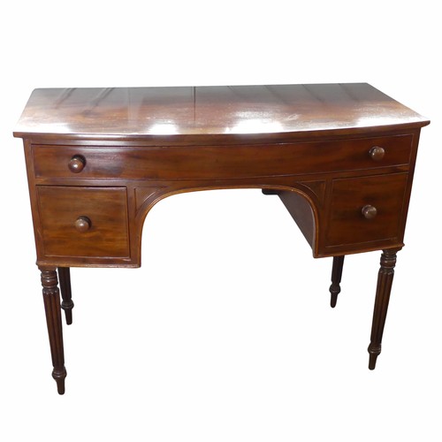 589 - A William IV style mahogany bow-front dressing Table, frieze drawer over kneehole, flanked by deep d... 