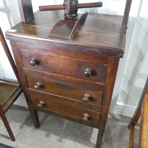 607 - A George III oak Book Press on Chest of Drawers, the rectangular press with turned thread and acorn ... 