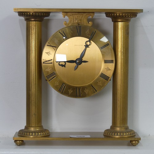 568 - A contemporary Hour Lavigne gilt metal cased mantel Clock, W 23.5 cm x H 25 cm x D 7 cm.... 