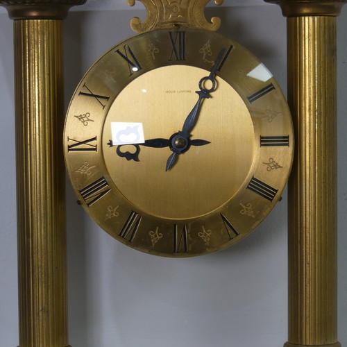 568 - A contemporary Hour Lavigne gilt metal cased mantel Clock, W 23.5 cm x H 25 cm x D 7 cm.... 