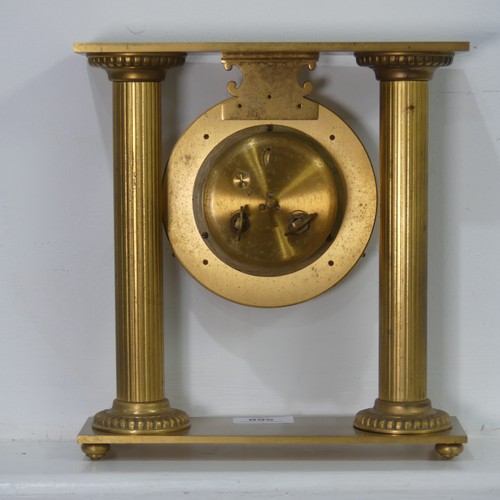 568 - A contemporary Hour Lavigne gilt metal cased mantel Clock, W 23.5 cm x H 25 cm x D 7 cm.... 