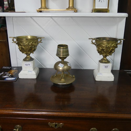 563 - A pair of gilt metal Urns, raised on stepped bases, W 18 cm x H 21.5 cm x D 11 cm, together with an ... 