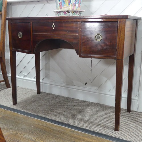 586 - A Georgian mahogany bow-front dressing Table, central drawer with ivory escutcheon flanked by deep d... 