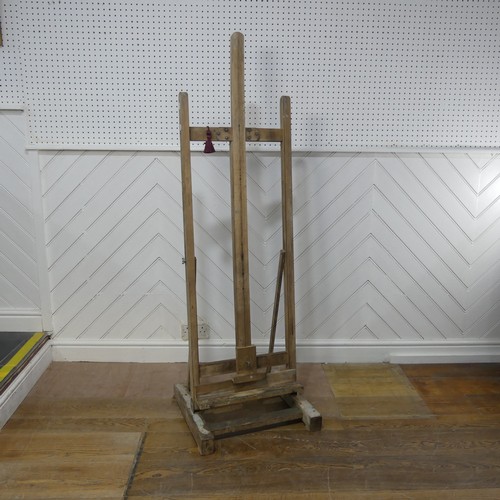 628 - A vintage floor standing artists Easel, with an adjustable canvas support, W 52 cm x H 160 cm x D 48... 