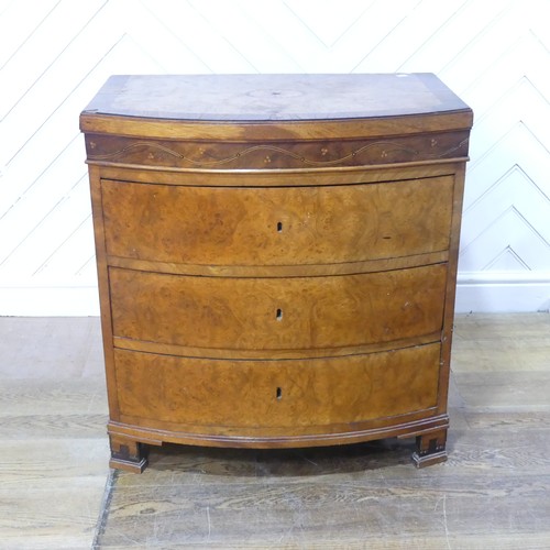 632 - A George III burr walnut and mahogany bowfront Chest of drawers, of small proportions, the bowed top... 