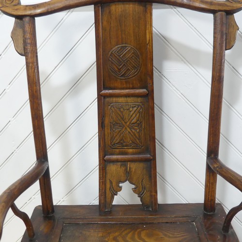 616 - An antique Chinese elm Armchair, with carved decorations, W 66c m x H 118 cm x D 52 cm.... 