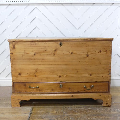 605 - A 19th century pine mule Chest, with hinged top over single drawer, raised on bracket feet, W 104 cm... 