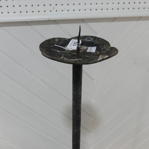 629 - An antique wrought iron ecclesiastical style candle Holder, W 28 cm x H 119 cm x D 28 cm.... 