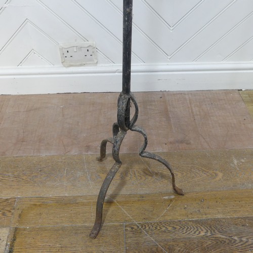 629 - An antique wrought iron ecclesiastical style candle Holder, W 28 cm x H 119 cm x D 28 cm.... 