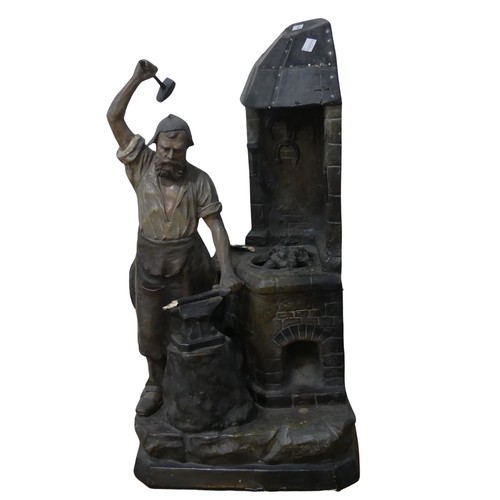 618 - An early 20th century Lamp in the form of Blacksmith, signed ''Aug Ott 1905'' (possibly August Otto)... 