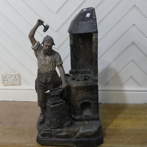 618 - An early 20th century Lamp in the form of Blacksmith, signed ''Aug Ott 1905'' (possibly August Otto)... 