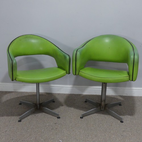 687 - A near pair of Retro mid-20th century swivel barbers Chairs, upholstered in green leatherette and ra... 