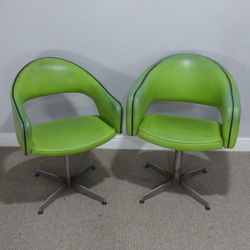 687 - A near pair of Retro mid-20th century swivel barbers Chairs, upholstered in green leatherette and ra... 