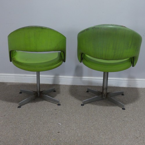 687 - A near pair of Retro mid-20th century swivel barbers Chairs, upholstered in green leatherette and ra... 